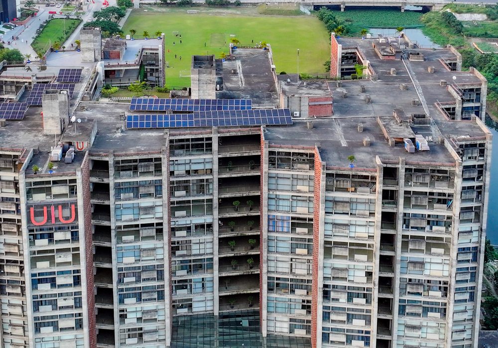Rows of solar panels on the roof of the UIU academic building
